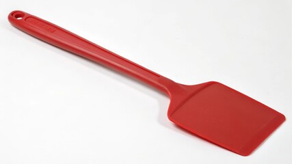 Cooking action with red spatula kitchen utensil clean environment top view culinary concept