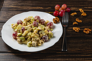 Colorful salad featuring almonds and red beets served on a decorative mat