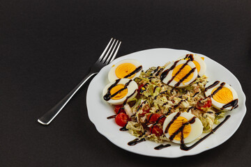 Moonlit clouds partially obscure the night sky over Lviv, Ukraine