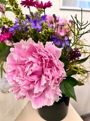 Blooming Paeonia composition in a vase. Flower bouquets. Floral background