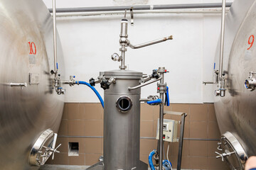 Stainless steel brewery equipment for craft beer production in industrial setting