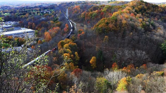 Cargo train in Dundas, Hamilton, seen from Dundas Peak in autumn, Ontario, Canada