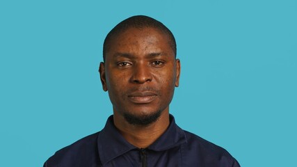 Headshot portrait of security guard at work smiling and overseeing premises. Joyful private law...