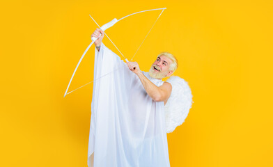 Valentines Day celebration. Valentine day cupid angel with bow and arrow. Smiling bearded man in...