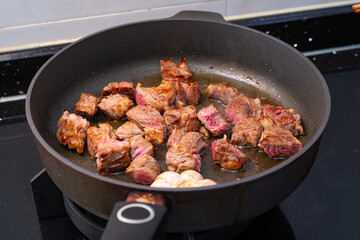 angle view beef dices being cooked