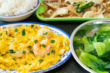 angle view food of shrimp stir-fried with eggs and steamed catfish fillet with mustard greens and vegetable and rice at horizontal composition