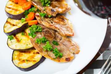 Barbecued lamb chops served with grilled aubergine and carrot