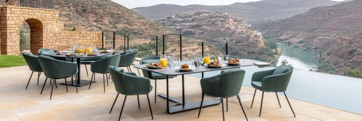 Outdoor dining set with scenic mountain and river view.