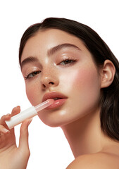 A close-up of a model applying lip gloss, showcasing beauty and skincare.