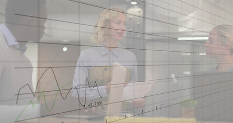 Image of data processing and diagrams over diverse colleagues discussing work