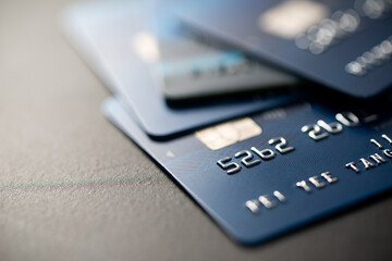 Macro low key credit card or debit card background with selective focus on microchip