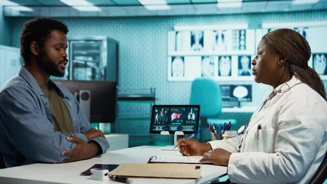 African american doctor and patient having in depth conversation about medical results, leveraging health reports to devise a wellness and treatment plan. Recommends list of medication. Camera B.