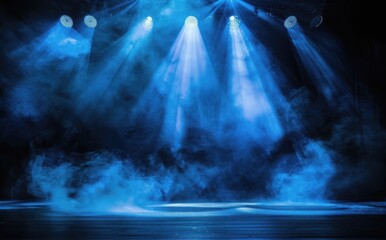 Empty stage illuminated by blue spotlights, creating a dramatic theatrical atmosphere