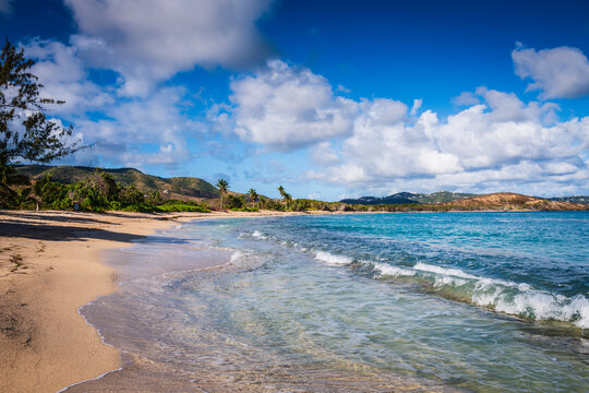 The private beach at The Buccaneer Hotel in St Croix Virgin Islands offers white sand, clear turquoise water, and secluded nooks.
