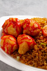 sweet and sour chicken, chinese fried rice and shrimp in close-up
