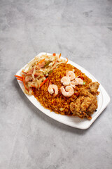 Chinese food of rice and fried chicken, chop suey, shrimp, on marble background