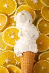 White lime ice cream cone on orange slices