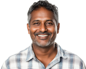 Smiling Indian man with gray hair wearing checkered shirt, isolated on transparency background, exuding warmth and friendliness