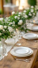 Fototapeta premium Elegant dining setup with fresh floral arrangements and fine tableware.