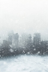 A city skyline shrouded in thick snowfall, creating a serene and mysterious winter atmosphere.
