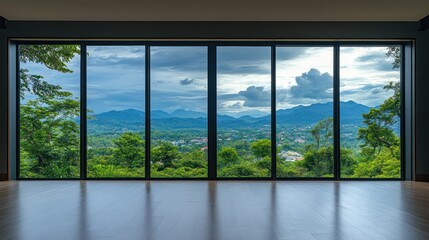Naklejka premium Panoramic Mountain View Through Large Windows