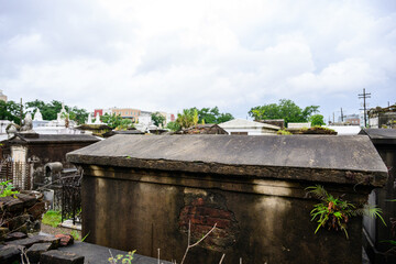 Obraz premium Old concrete tombs in cemetery New Orleans halloween