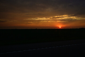 sunset over the country field