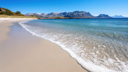 serene beach with gentle waves lapping at shore, surrounded by mountains