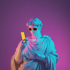 A statue of a man wearing sunglasses and holding a cell phone