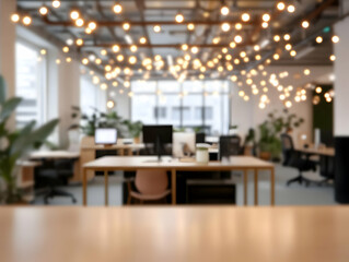 Blurred view of modern office interior with wooden desks and decorative lights effectively creating a cozy ambiance.