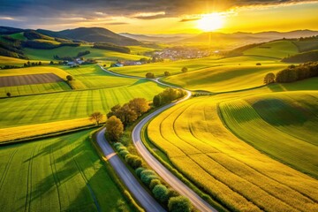 Aerial view:  Austria's rolling hills burst with yellow rapeseed, a ribbon of road meandering below.