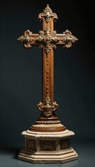 Ornate wooden cross on stone pedestal with intricate carvings and gilded details, gilded, decorative