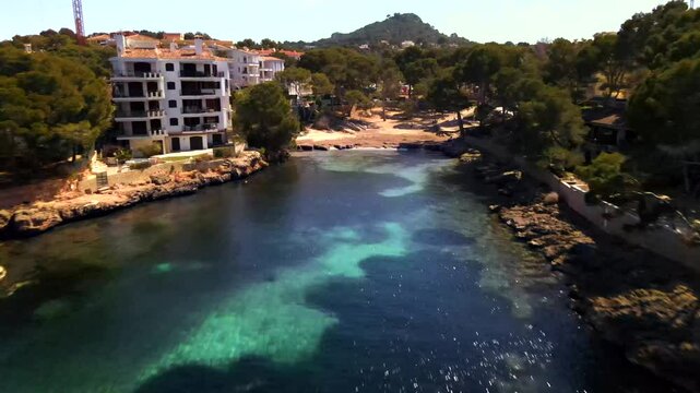Explore the tranquil beauty of Santa Ponsa in Mallorca, where clear blue waters meet lush greenery and sandy beaches. Perfect for nature lovers and vacation seekers enjoying a peaceful getaway.