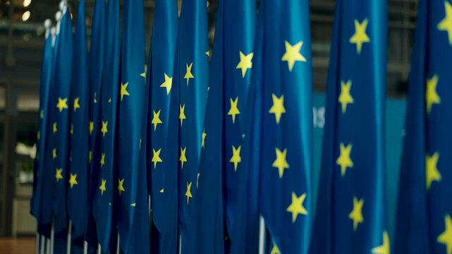 Beautiful row of European Union flags with stars - Defocus shot