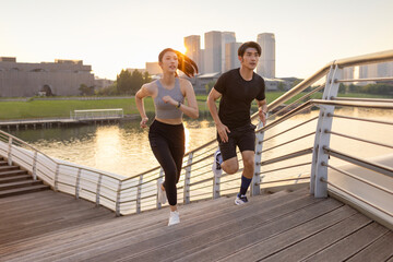 Young couple running on the steps