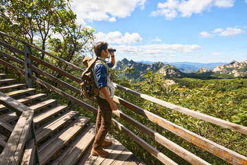 Happy man hiking in the mountains