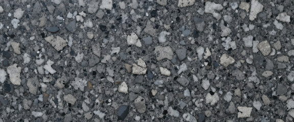 Close-up view of a textured concrete surface with aggregate stones.