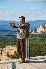 Happy man hiking in the mountains