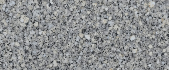 Close-up of a speckled gray stone surface texture.