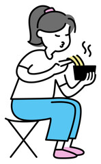 Young woman eating noodles with chopsticks