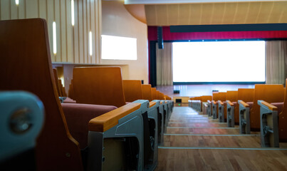 Empty auditorium with many chairs