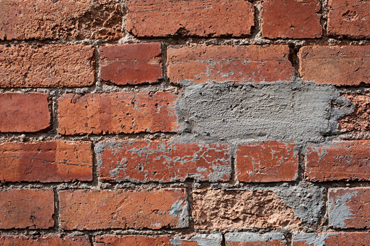 Fototapeta close up of an old red brick wall
