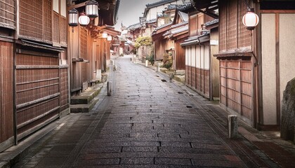 Tranquil morning in a historic Japanese town.  Wooden houses line a stone street.