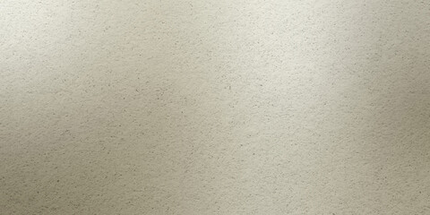 Soft beige surface showing varied texture and subtle patterns in warm lighting conditions