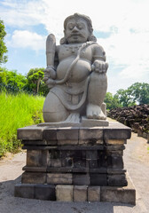 Obraz premium Dwarapala statues in Prambanan Temple area, in Sleman, Special Region of Yogyakarta, Indonesia. The staute is a doorkeeper or guardian of the entrance gate to the temple.
