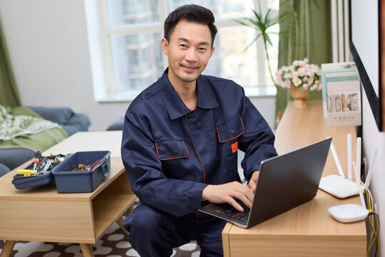 IT technician fixing the laptop