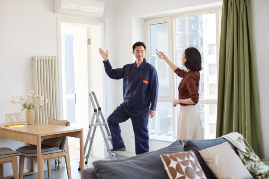 Handyman fixing the air conditioner