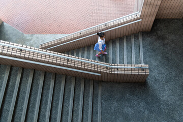 Woman walking on the staircase
