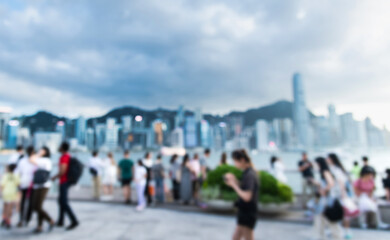 Blurred image of people walking on the Hong Kong waterfront