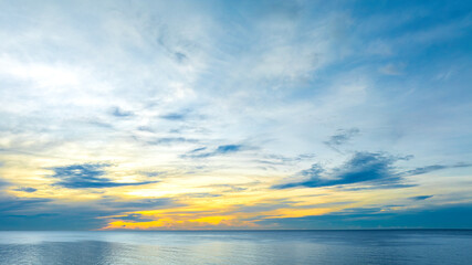 Background for summer vacation concept Nature of the beach and sea summer with sunset The sea sparkles against the sunset sky at sea